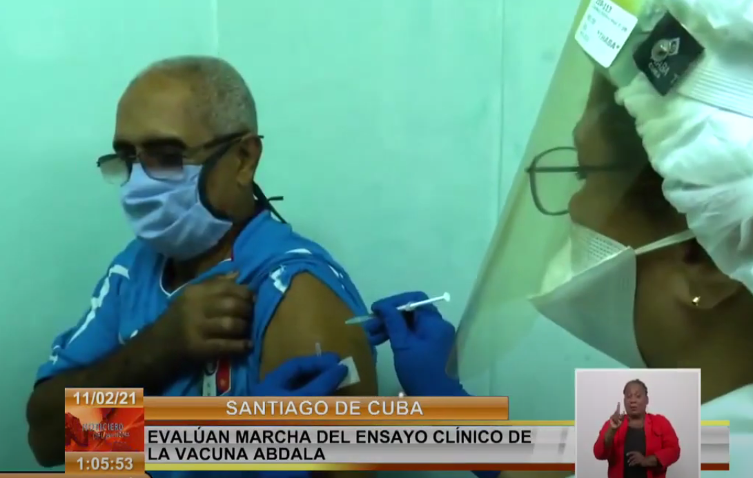 Picture: covid vaccination in Cuba, picture of a medical professional vaccinating a Cuban man