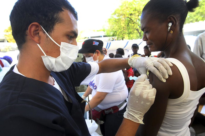 photo of Cuban doctor vaccinating a Haitian woman - photo from https://www.flickr.com/photos/un_photo/4370894206